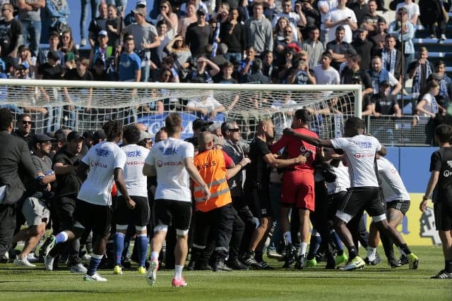 VIDEO: French football shamed as fans attack players on pitch