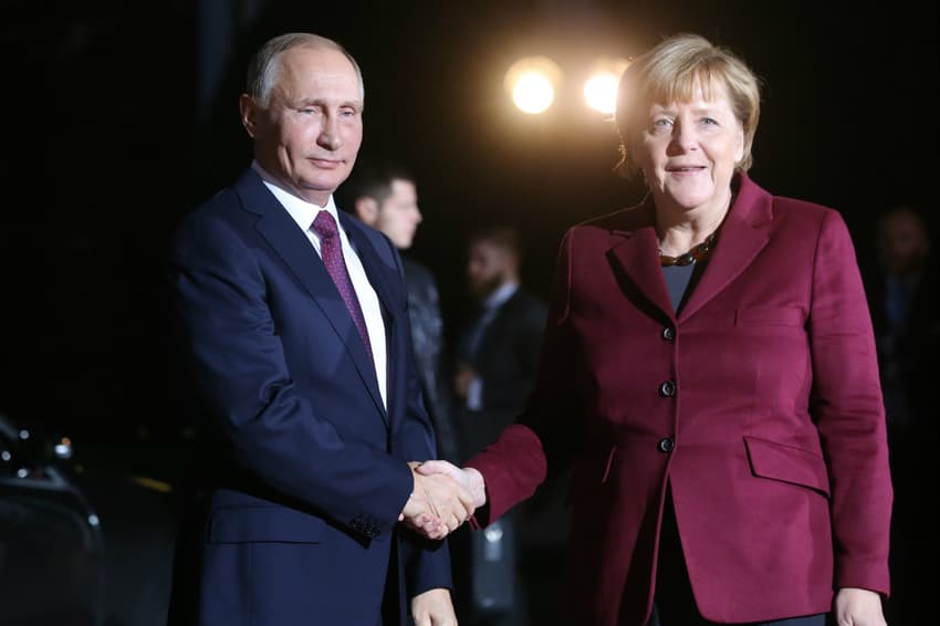 Merkel makes rare Russia visit as Putin backs warmer ties
