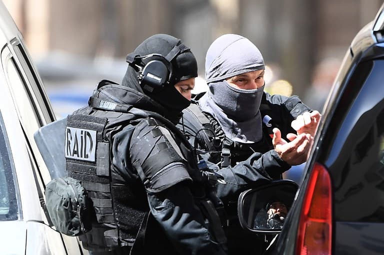 French anti-terror police seize heavy weapons and arrest five in raids: reports