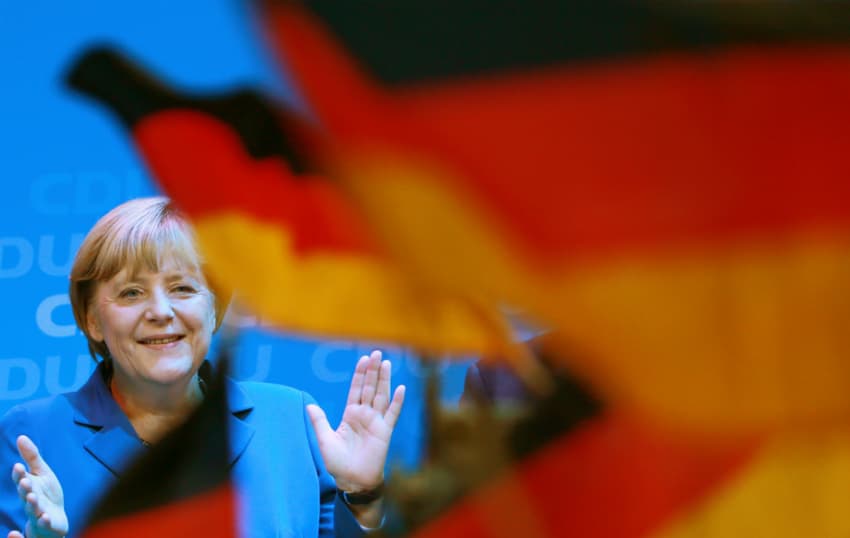 Merkel campaigns with German flag to steal a march on nationalists