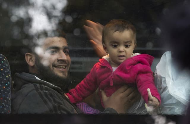First Syrian refugees arrive in France under deal with Christian groups