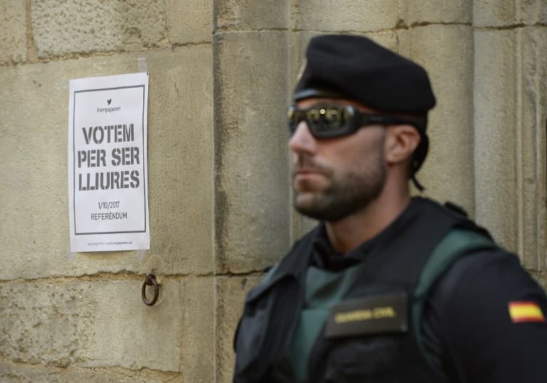 Spain seizes Catalan referendum posters and summons mayors