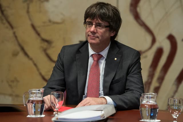 Calling election in Catalonia wouldn't put Puigdemont in the clear, Spain's justice minister warns