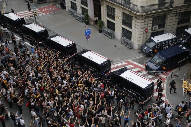 Catalan hotels evict Spanish police as crowds protest violence at the polls