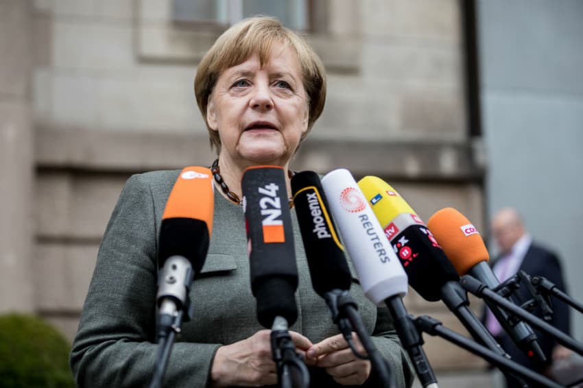 Merkel warns of tough talks as clock ticks on coalition deal