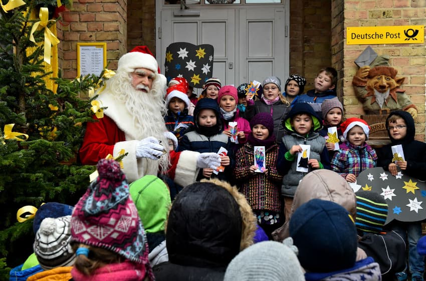 Wish lists from children worldwide pile up at Santa's post offices in Germany