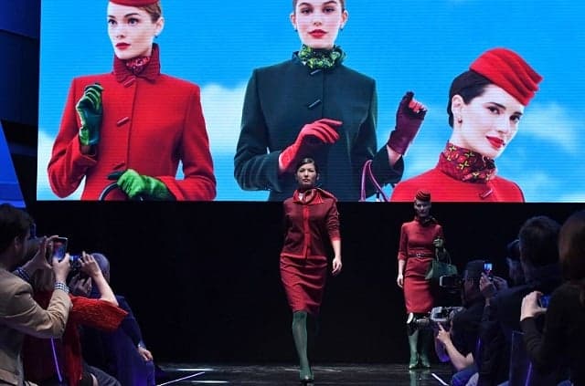 Crisis-hit Alitalia unveils new designer uniforms for staff