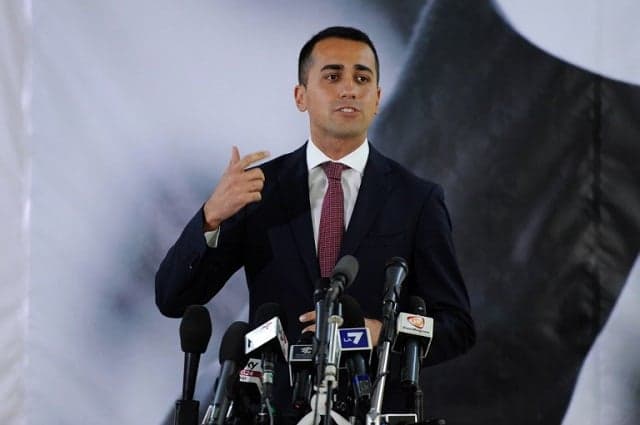 Italy's Five Star Movement leader softens stance on euro and party alliances ahead of 2018 election