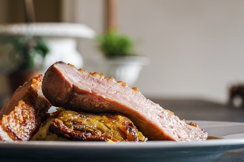 Why do Danes eat duck and pork at Christmas?