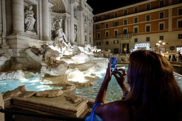 Rome tourist fined after trying to climb Trevi Fountain