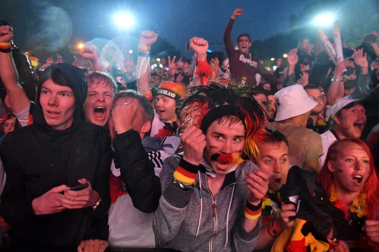 Fans dance in Berlin rain as Germany avoids World Cup exit