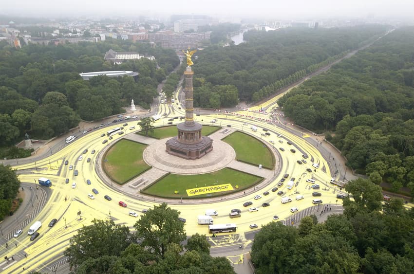 Greenpeace colour streets of Berlin yellow to protest against coal