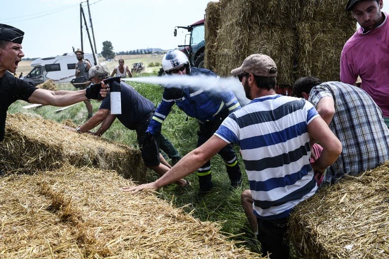 Tear gas halts Tour de France amid French farmers' protest