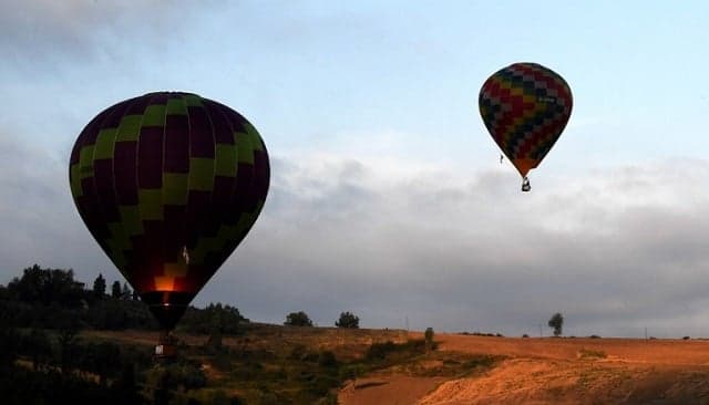 IN PICTURES: Dozens of hot air balloons fill the sky in central Italy