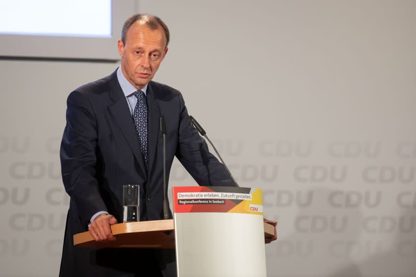 CDU candidate Merz calls German asylum law into question