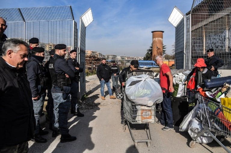 Italian police evict immigrants from Rome camp