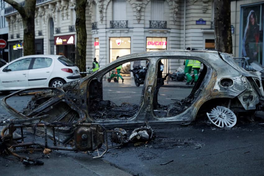 Paris in pictures: Abandoned barricades and burned cars