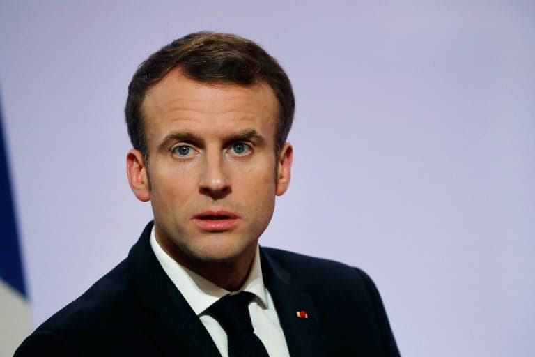 Somber Macron hikes minimum wage in hope of calming 'yellow vest' rebellion