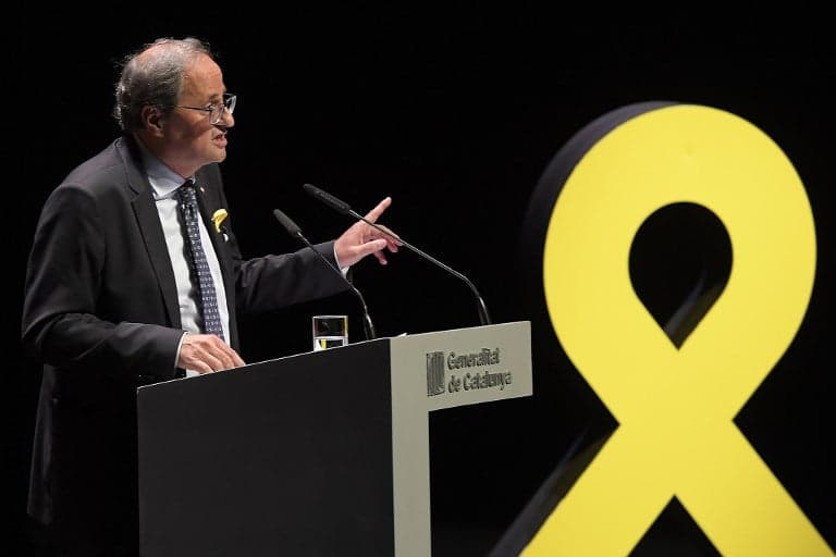 Catalan president seeks way around independence symbols ban