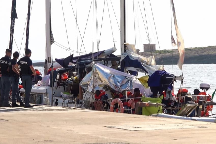 Migrant rescue sailboat defies Salvini by docking in Italy