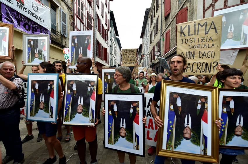 France anti-G7 activists march with 'stolen' Macron portraits