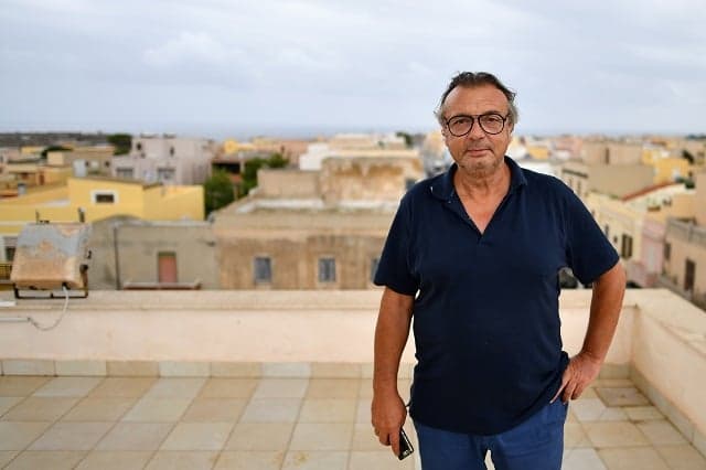 Lampedusa mayor denounces Italy's collapsing government over migrant boat standoff