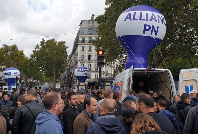 Why are French police holding an historic 'angry march' in Paris?