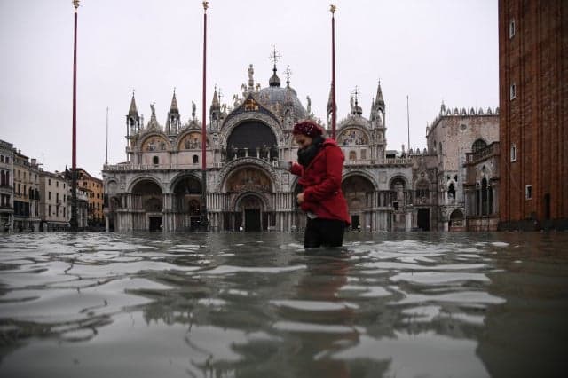 In Pictures: Venice left submerged as exceptional tide sweeps through canal city