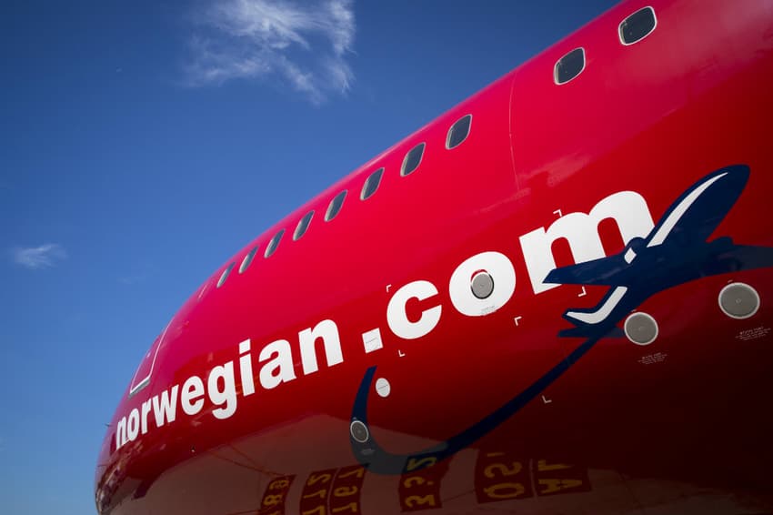Struggling Norwegian lingers in the red, cuts capacity again