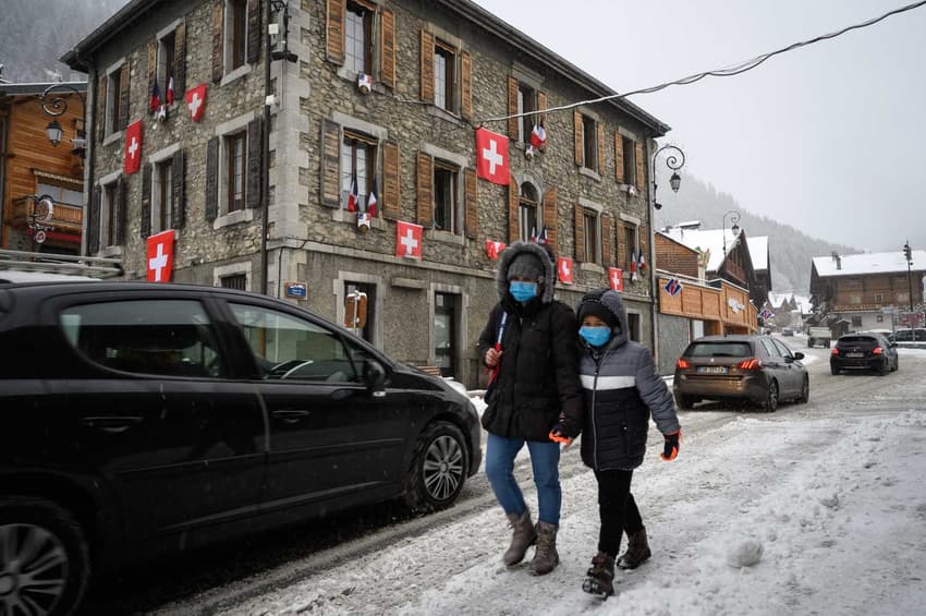 IN PICTURES: Swiss flags hang over protesting French ski village