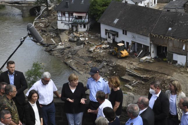 Germany's Merkel sees 'surreal' wreckage as Europe flood death toll tops 180
