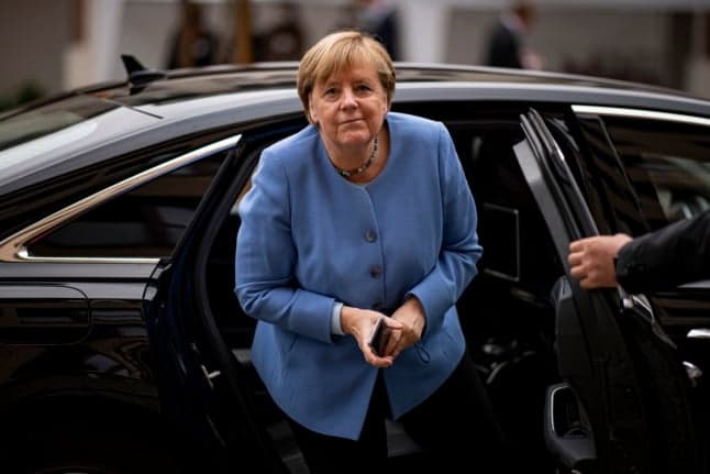 Germany's Scholz gets Merkel boost in coalition battle
