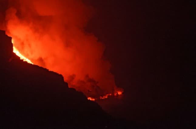 Ringside seat for fearful villagers as La Palma volcano spews fire