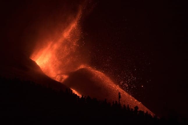 Thousands locked down as La Palma volcano destroys cement works