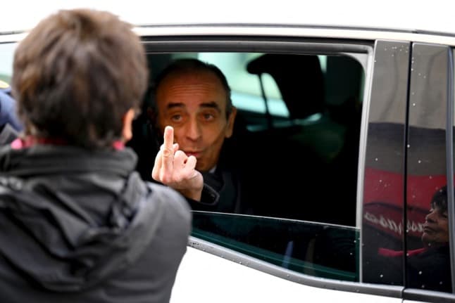 France's Zemmour gives finger to critic as campaign woes mount