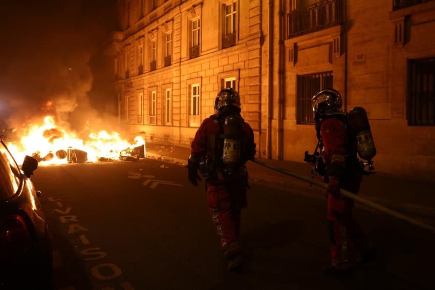 In Pictures: Barricades set on fire in Paris as pension reform protests turn violent