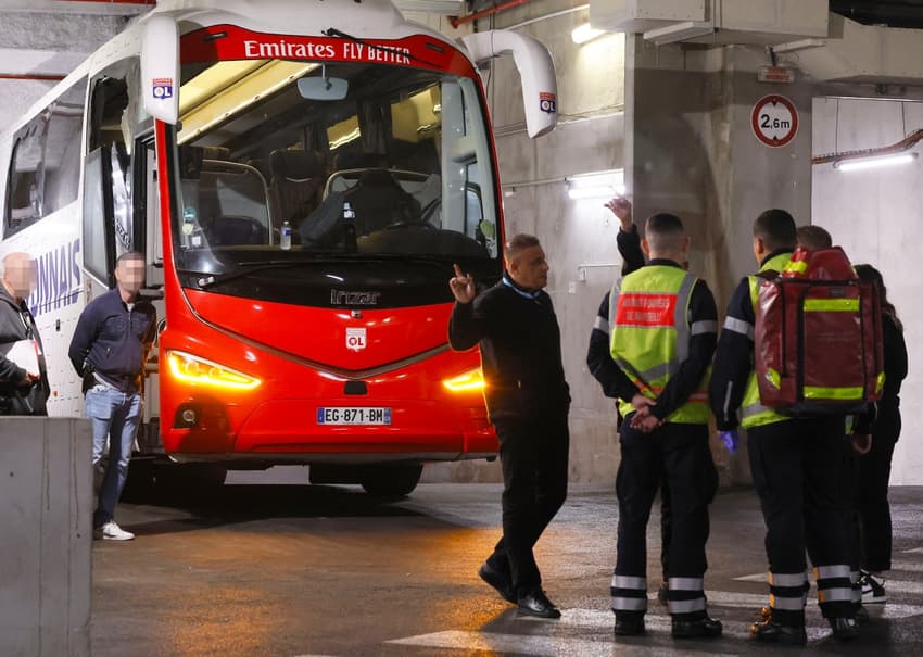 French football match postponed after team bus stoned and coach injured