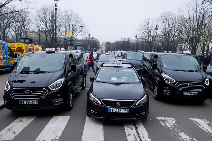 Paris taxi drivers launch unfair competition case against Uber