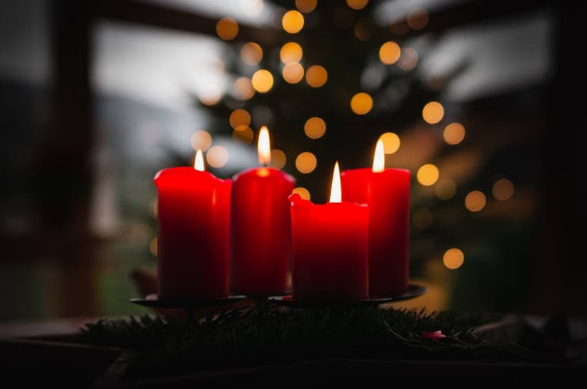 Why do the Nordic countries light candles on each Sunday of Advent?