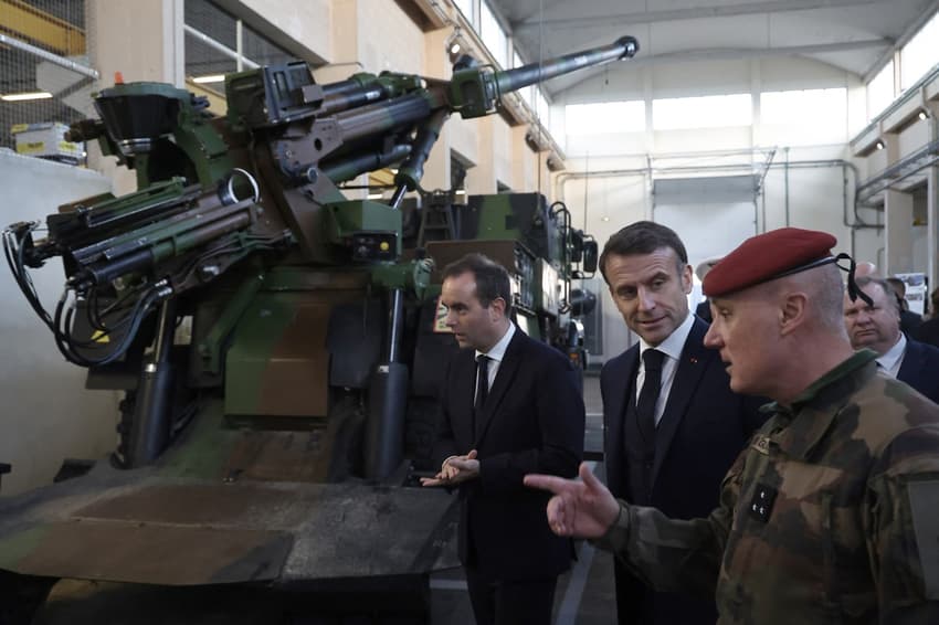 Macron urges French defence firms to ramp up production