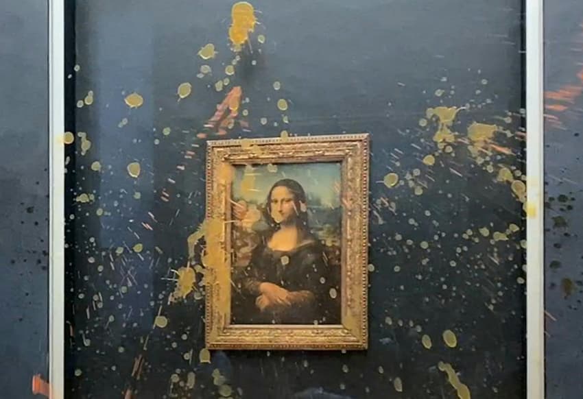 Eco-activists splash soup on glass-protected Mona Lisa in Paris