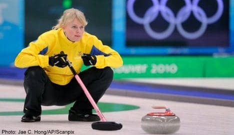 Sweden defends curling gold
