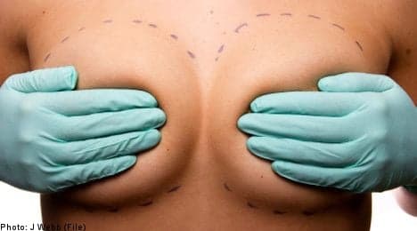 Woman's fake breasts burst after knife attack