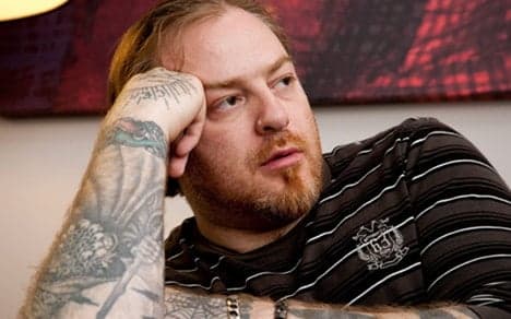 Munich opera defends Nazi tattoo singer