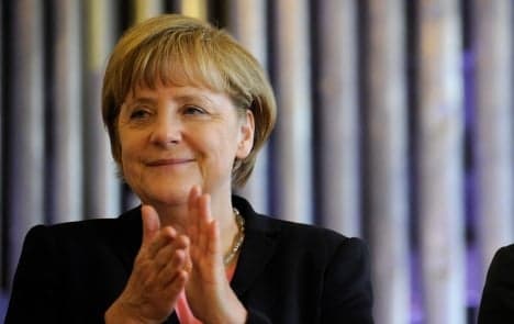 Businesses to Merkel: stick to guns on euro