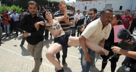 French feminists held after baring all in Tunisia