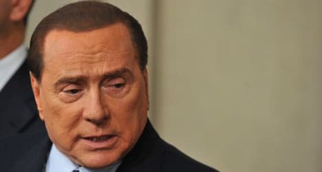 Berlusconi pledges to stay in politics if ousted