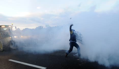 Riot police use tear gas on French tax demo