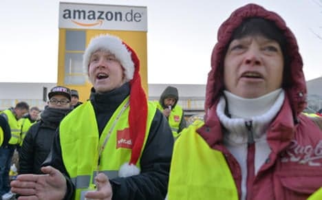 Amazon staff strike as pay battle rages