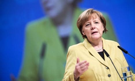 Merkel defends tough line on Greece